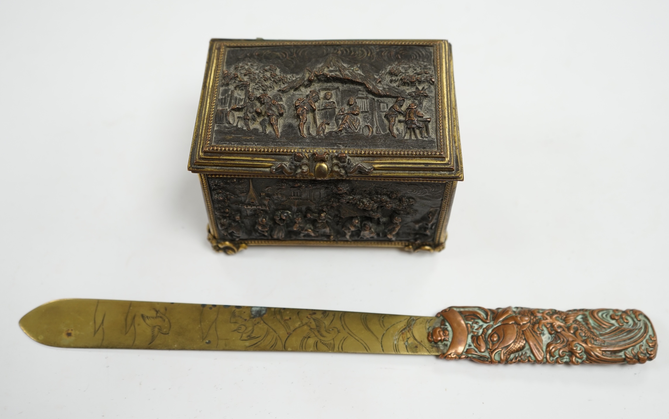 A Paris cast repousse figurative casket and a Japanese copper and brass paper knife, knife 30cm long. Condition - fair